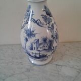 Blue vase adorned with blue and white