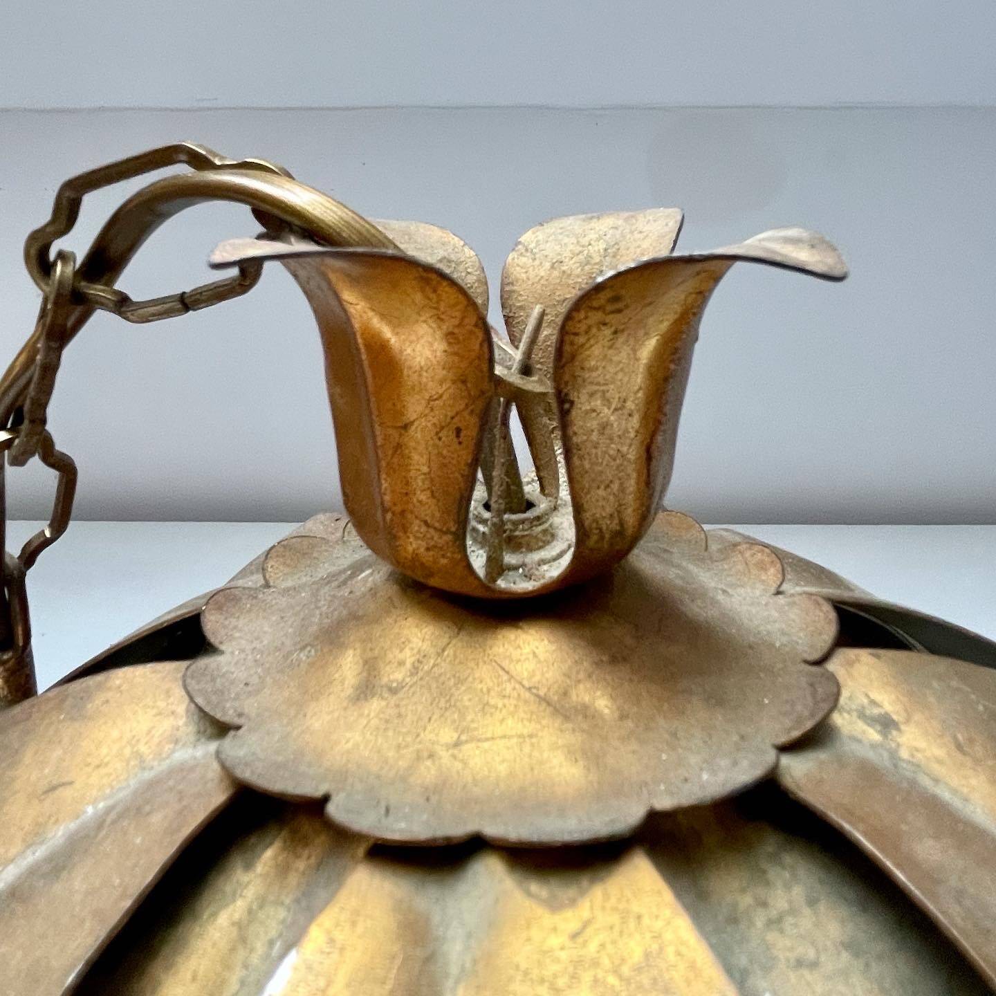 Two vintage pendant lights in gold metal