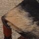 Tabouret en bois massif et peau, travail du XXe siècle