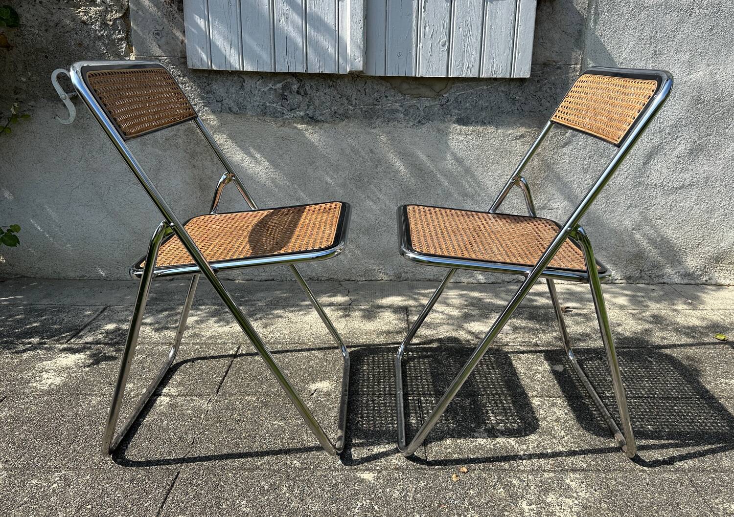 Pair of vintage metal caned folding chairs