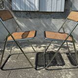 Pair of vintage metal caned folding chairs