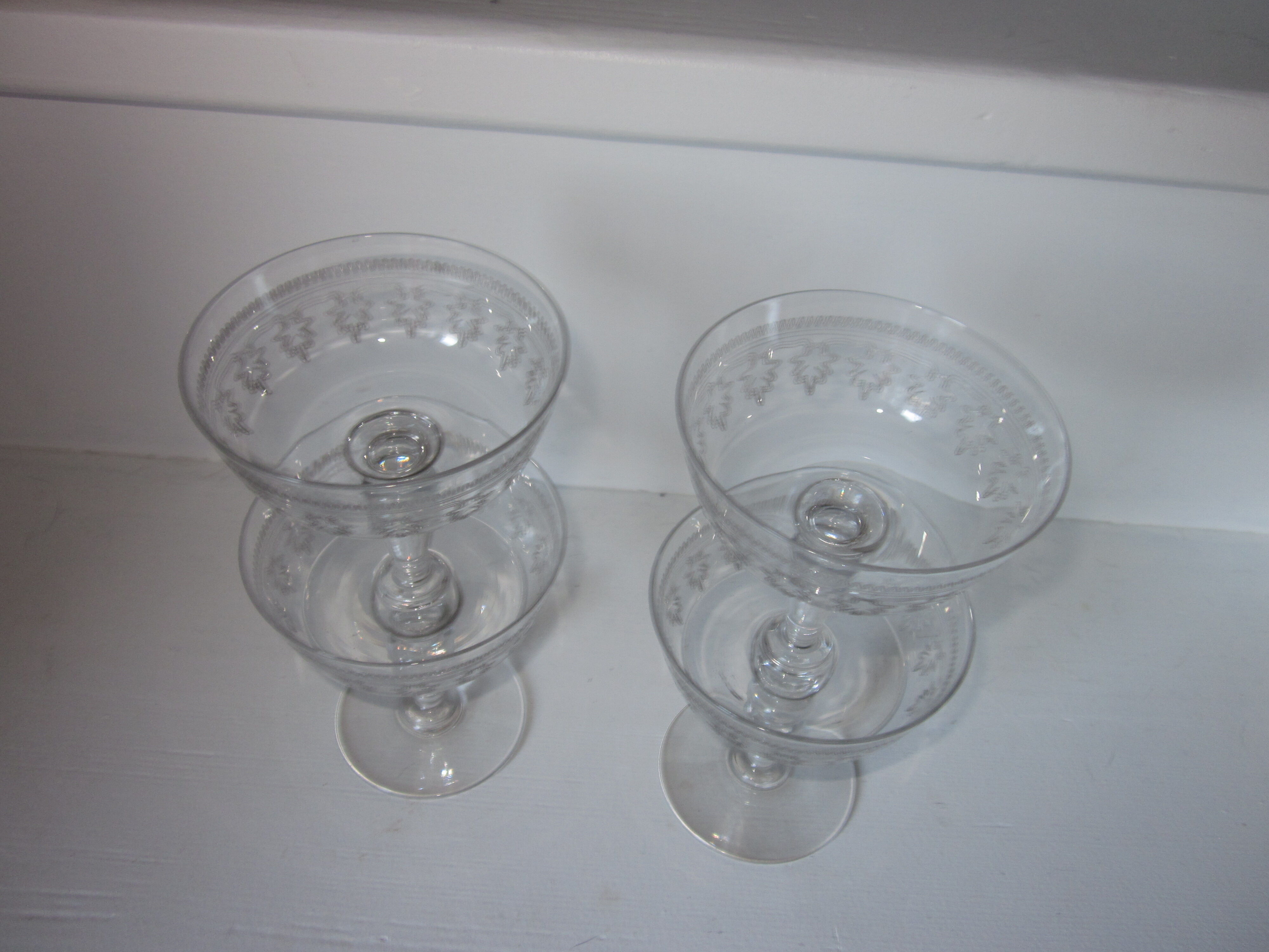 4 old champagne glasses