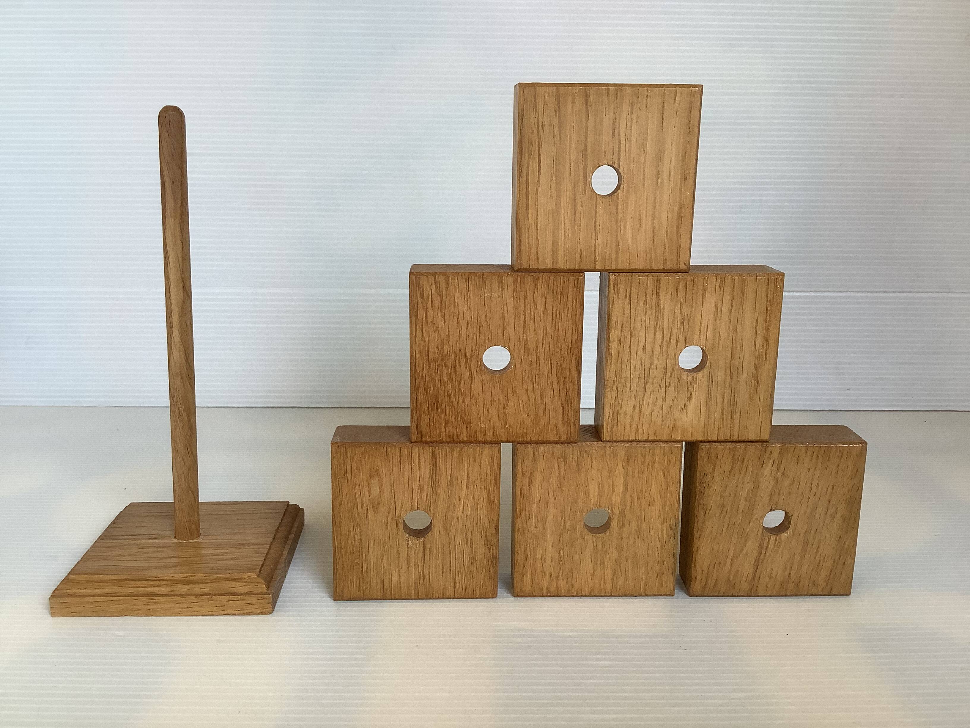 Six wooden egg cups and their Scandinavian style support