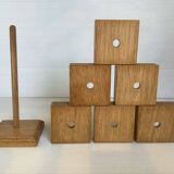 Six wooden egg cups and their Scandinavian style support