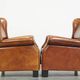 Set of 2 very comfortable large sheepskin armchairs elegantly finished with black piping