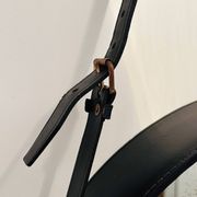 Jacques Adnet circular leather and brass mirror