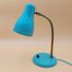Green brass desk lamp with a goose neck on a ball joint from the 1960s.