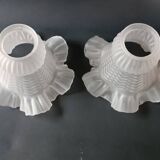 Brass and frosted glass wall lights