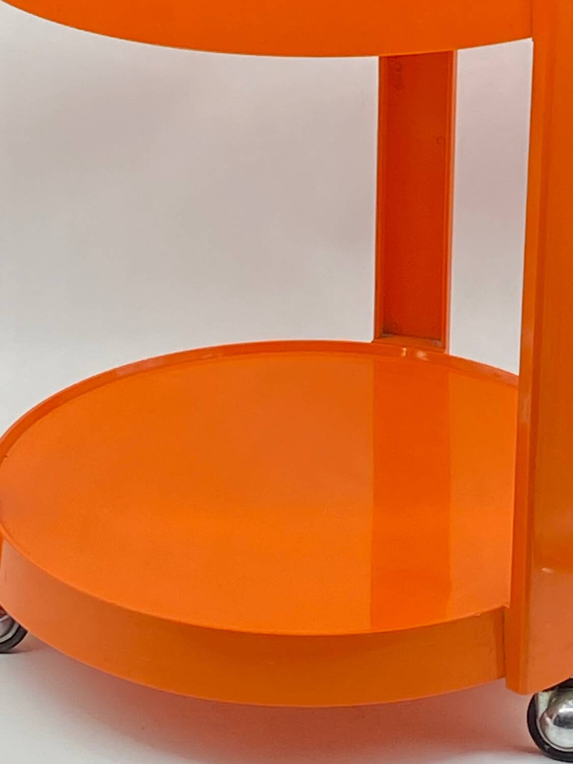 Vintage / designer / orange plastic rolling trolley,