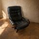 Scandinavian swivel lounge chair in black leather with a bent wood frame, 1970s.