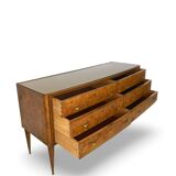 Veneered burl walnut chest of drawers with light warm brown glass top