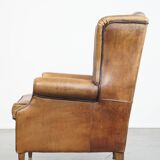 Sheep leather wingback chair finished with black piping