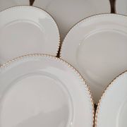 Set of 11 flat plates in porcelain Bavaria beige bordered gold model Jutta