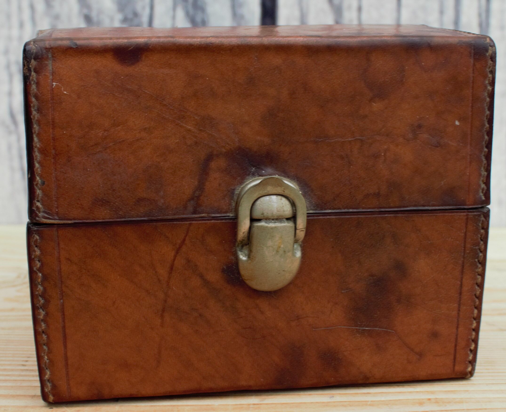 Antique leather case with 3 beveled bottles