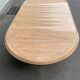 Round extendable farmhouse dining table, stripped, Louis XIII style from the 1960s.