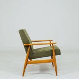 Mid-century modern design armchair in olive green corduroy.