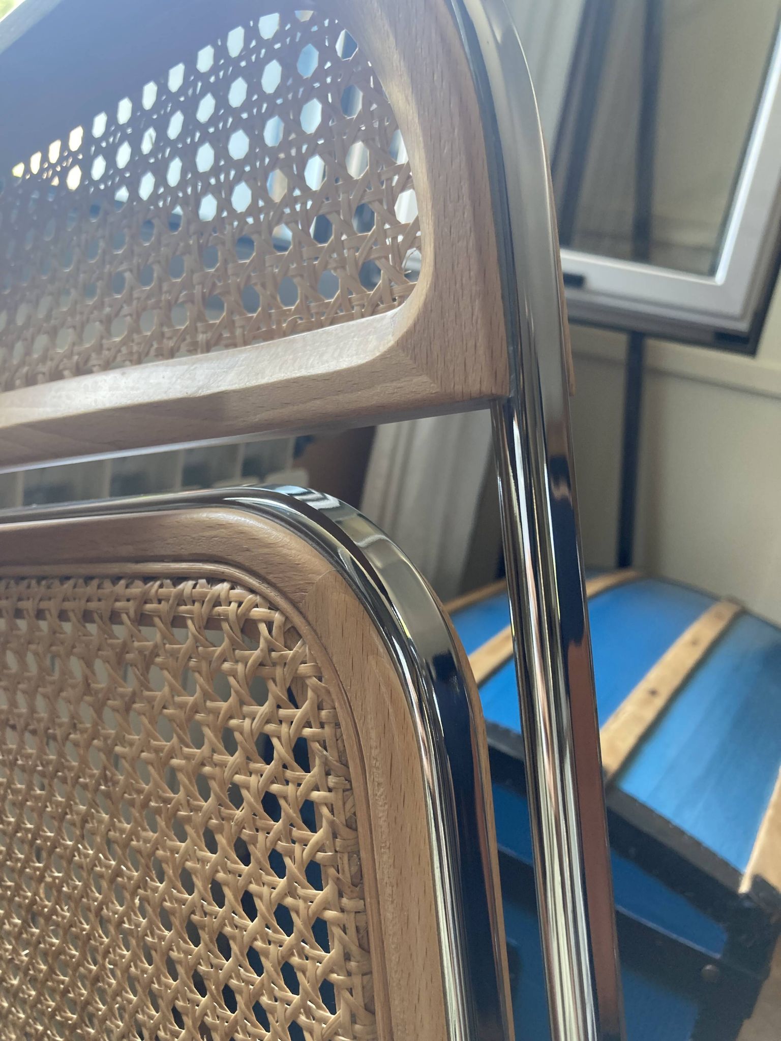 Plia chairs by Castelli in wood and cane.