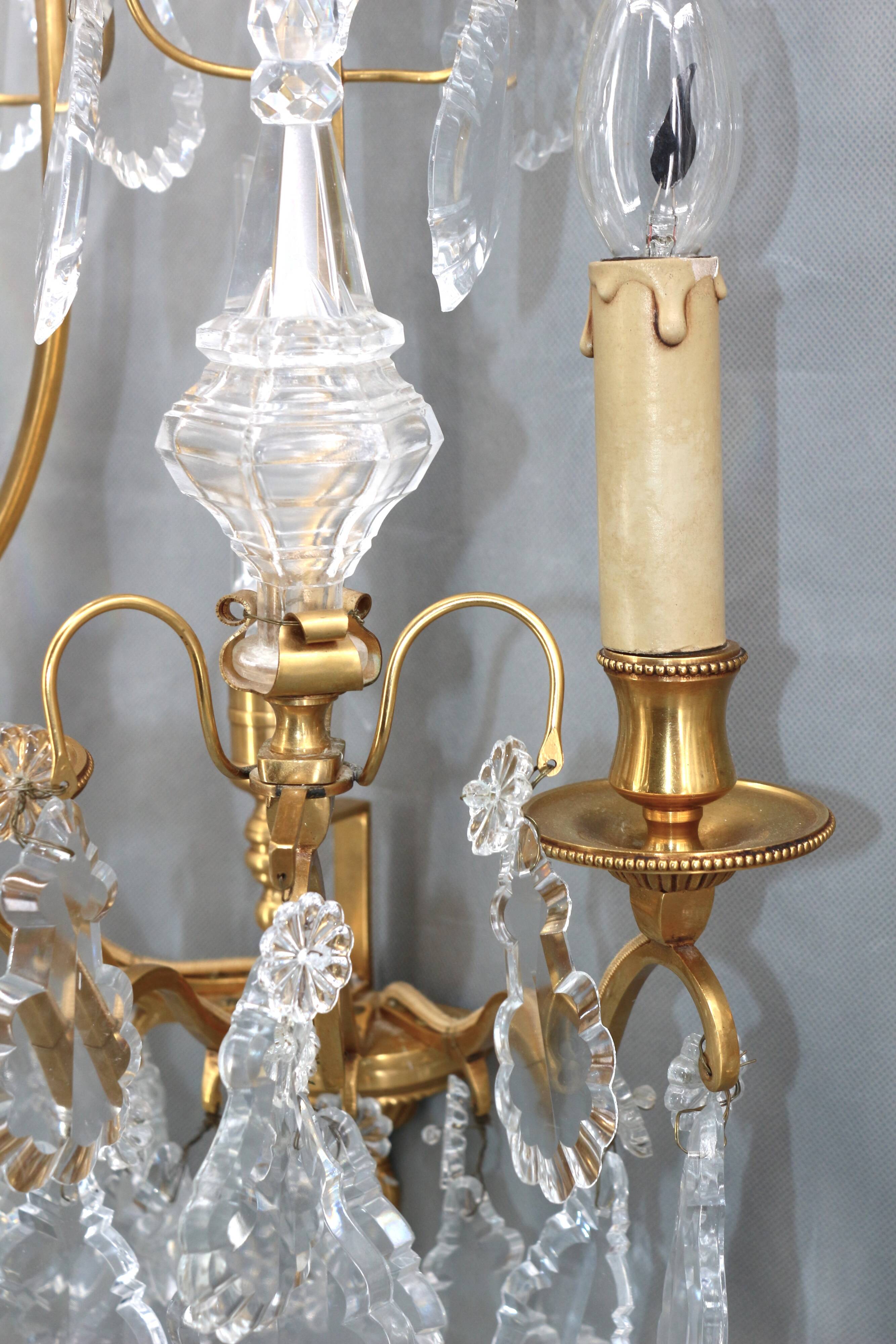 Pair of Louis XVI style gilded bronze & bohemian crystal sconces