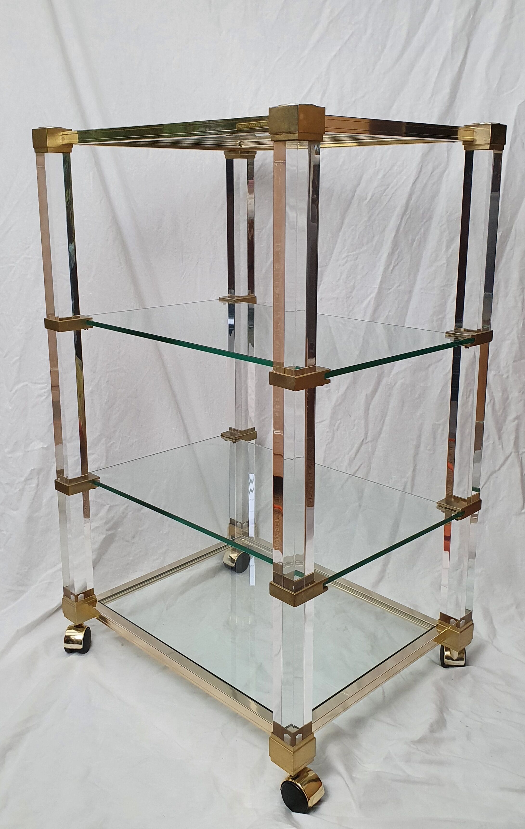 Rolling glass and plexiglass shelf by Pierre Vandel