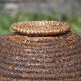 Old basket with lid, burgundy straw and bramble, woven basket, interior decoration