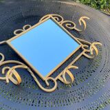 Wall-mounted gilded wrought iron coat rack with mirror