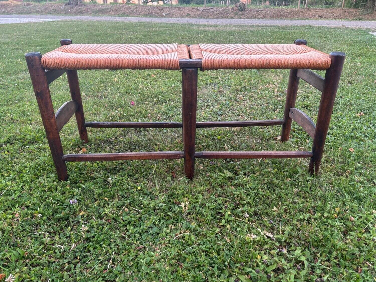 Two-seater straw bench, French rural style, wood and rush, early 20th century.