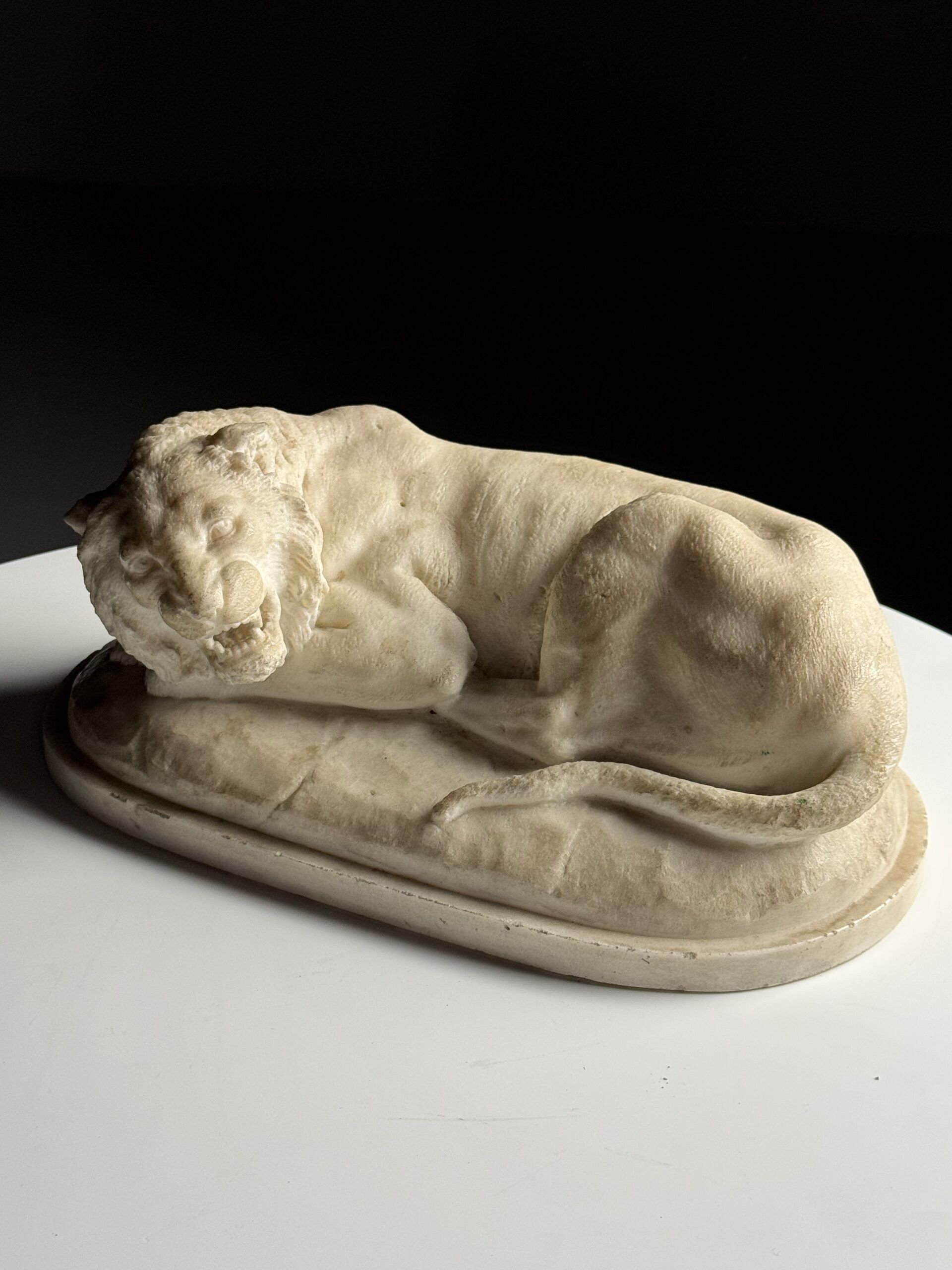 Marble sculpture of a reclining lion