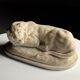 Marble sculpture of a reclining lion