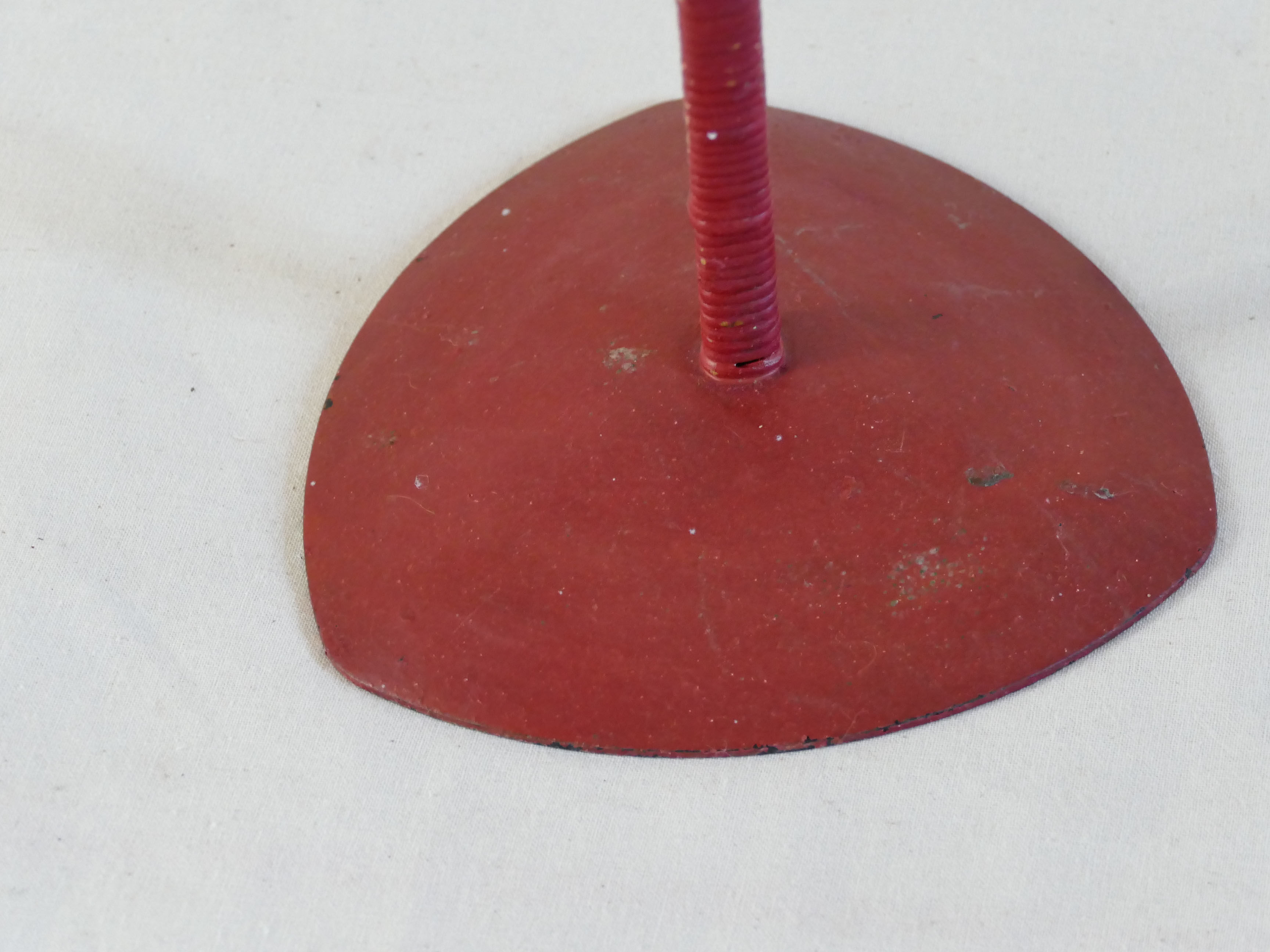 Red metal chandelier for three candles