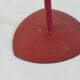 Red metal chandelier for three candles