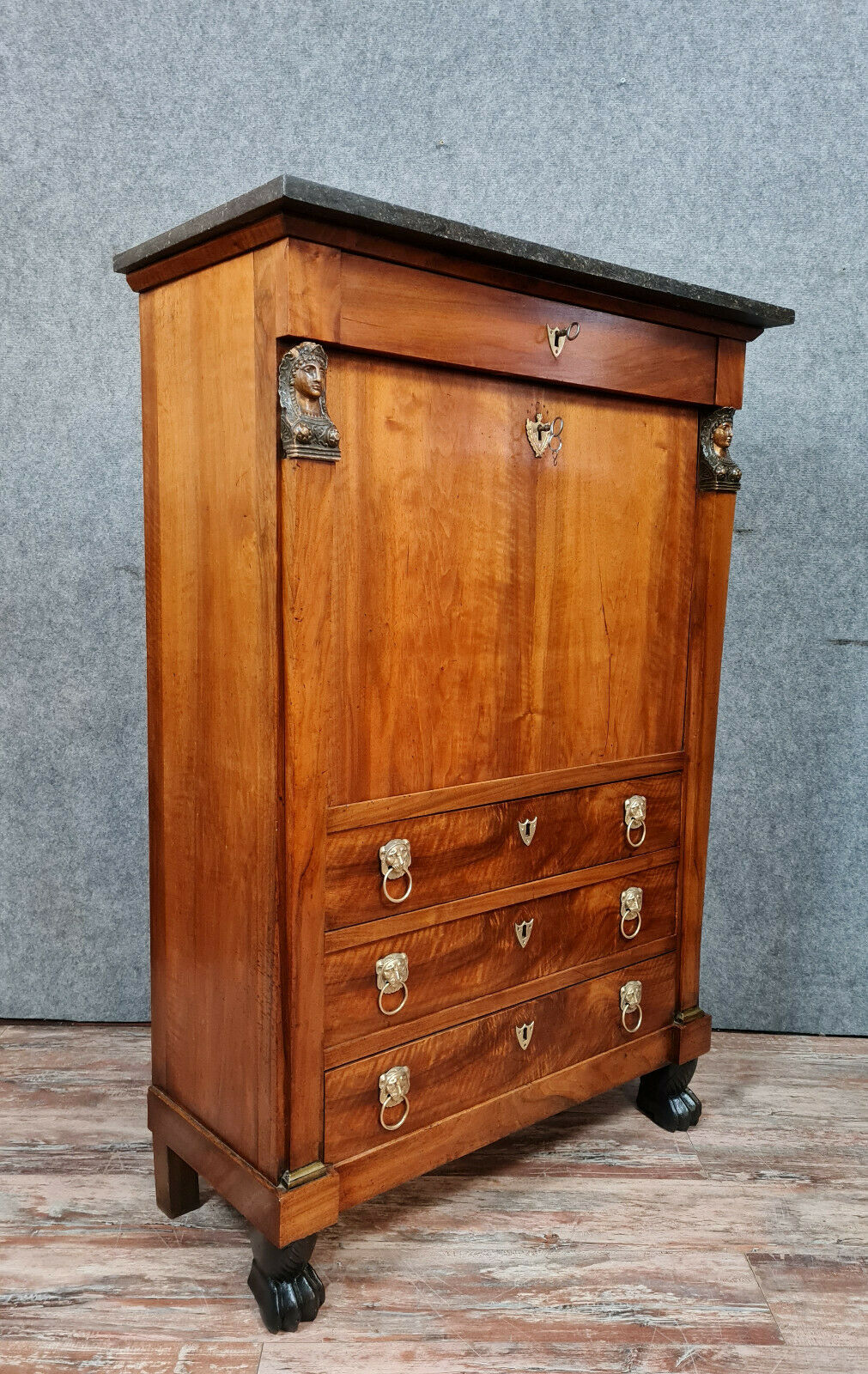 Secretary empire era with caryatid in blond mahogany around 1810