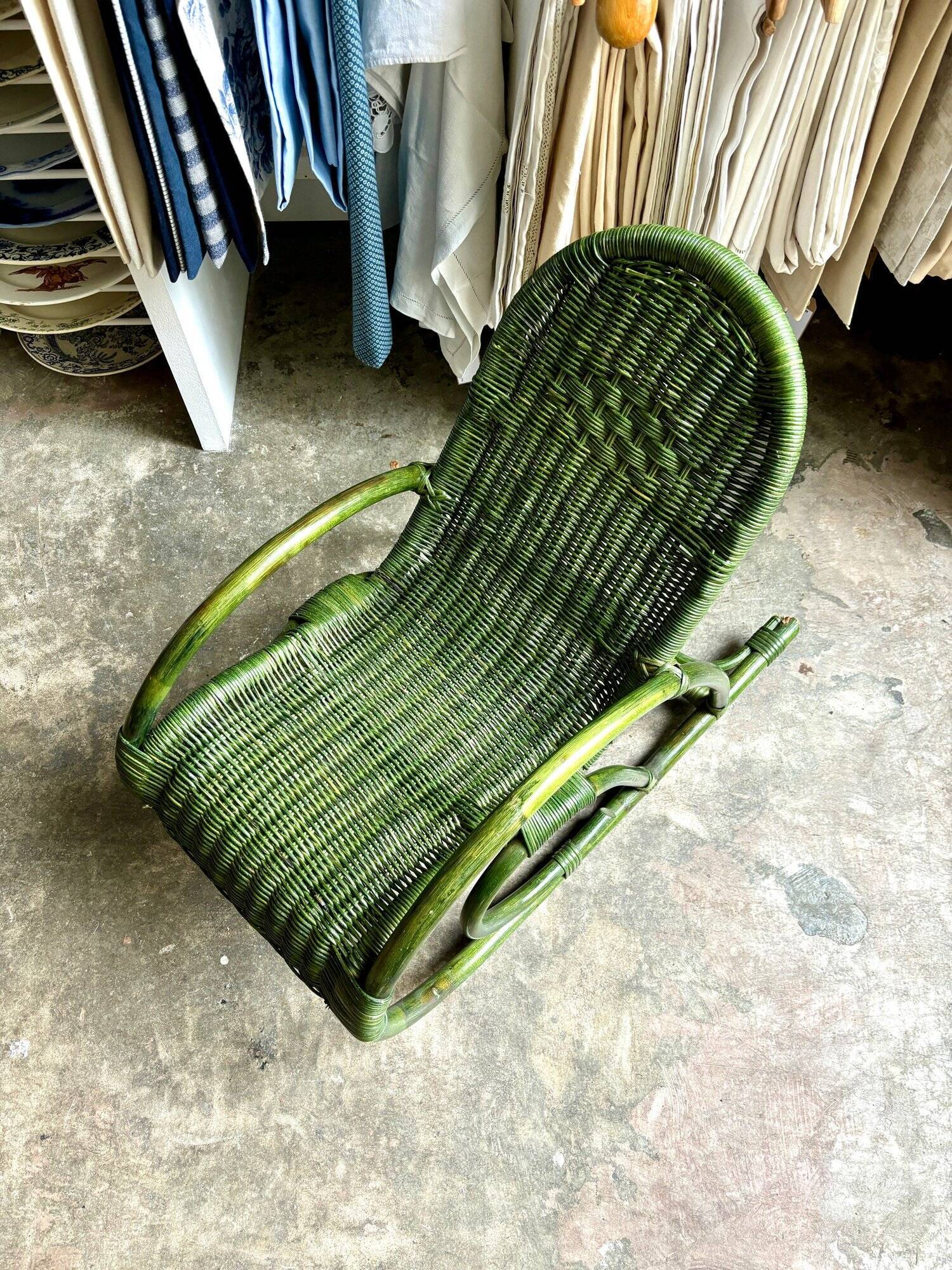 Children's rocking chair in woven wicker and green rattan