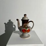 Vintage stoneware teapot with flower and fruit patterns