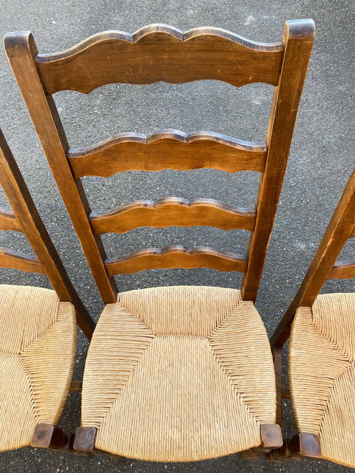 4 or 5 solid wood chairs with light oak straw and high backs