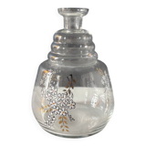 Vintage glass carafe with floral decoration