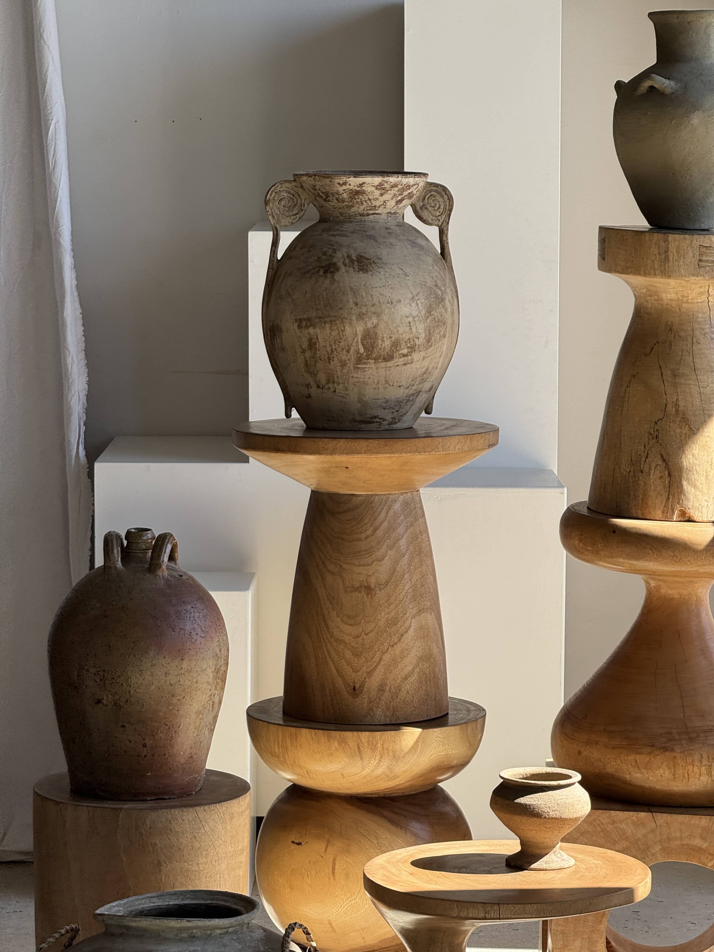 Natural solid mango side table (monoxyle) with conical legs.