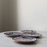 4 colorful flat plates with a fish pattern