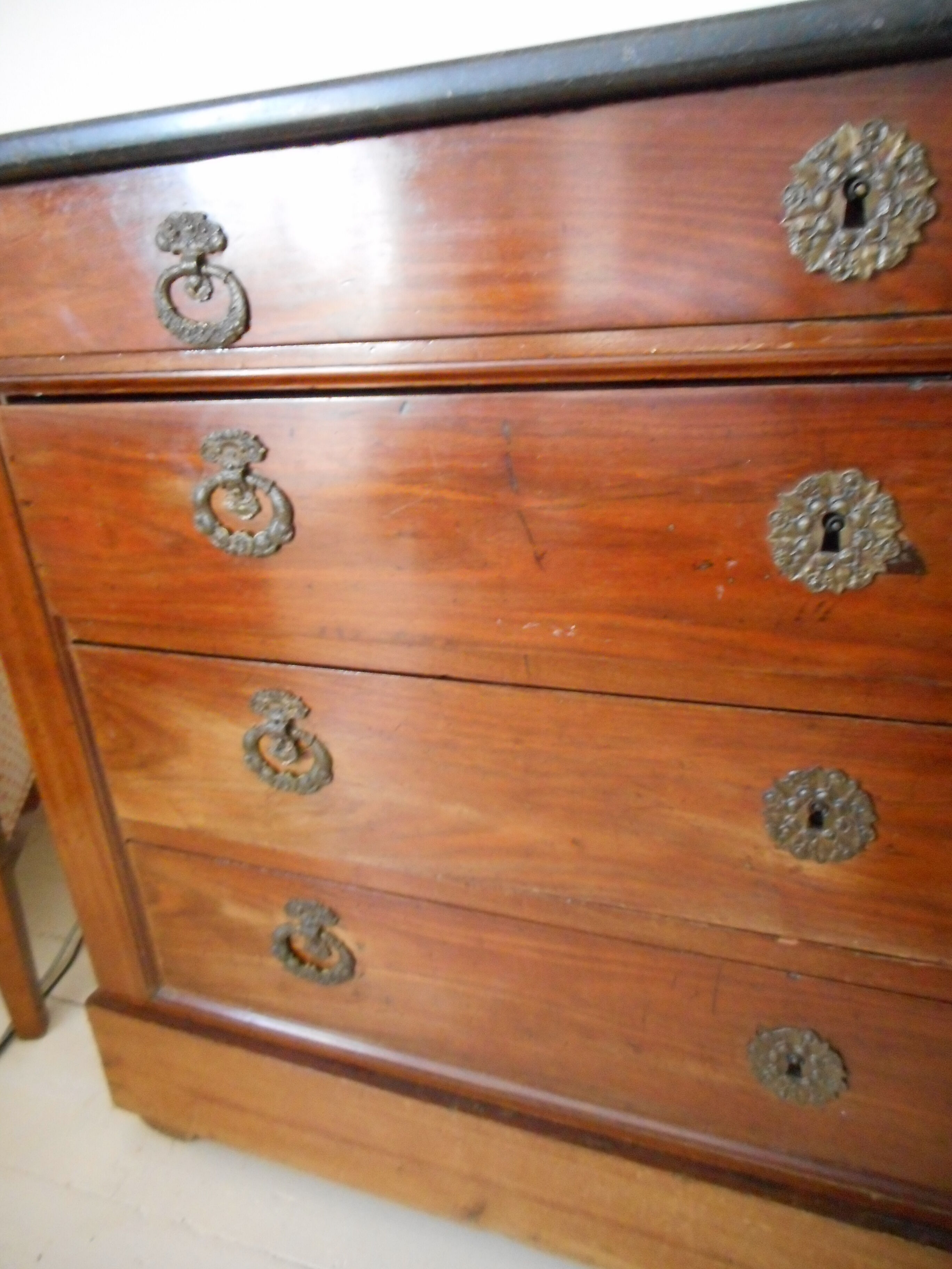 Old chest of drawers with black marble