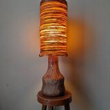 Table lamp with terracotta base and resin shade.