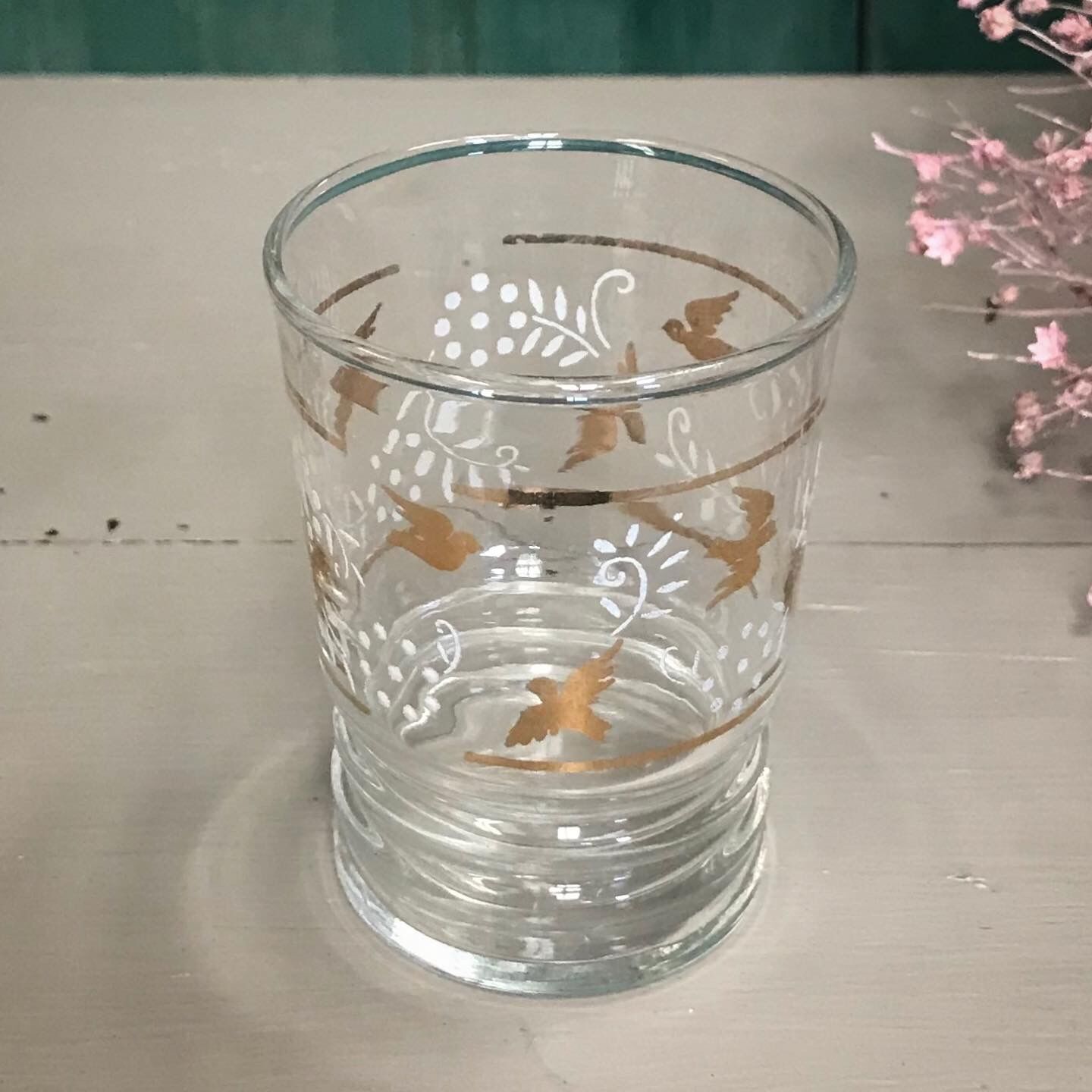 Six glasses old flowers and birds