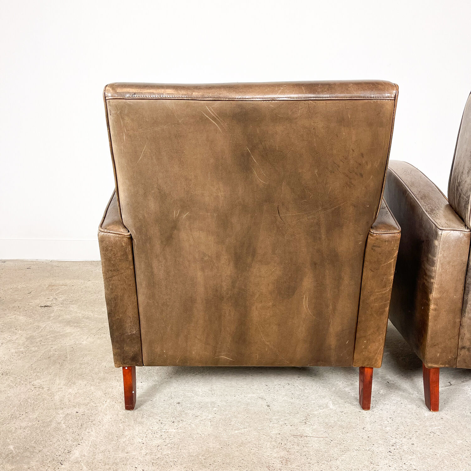 Set of two vintage leather wagon wheel armchairs Haarle