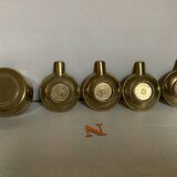 Four individual brass ashtrays