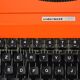 Machine à écrire orange Underwood 130 - vintage 70