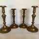 Four brass candle holders