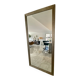 Textured embossed metal wall mirror with bevelled mirror.