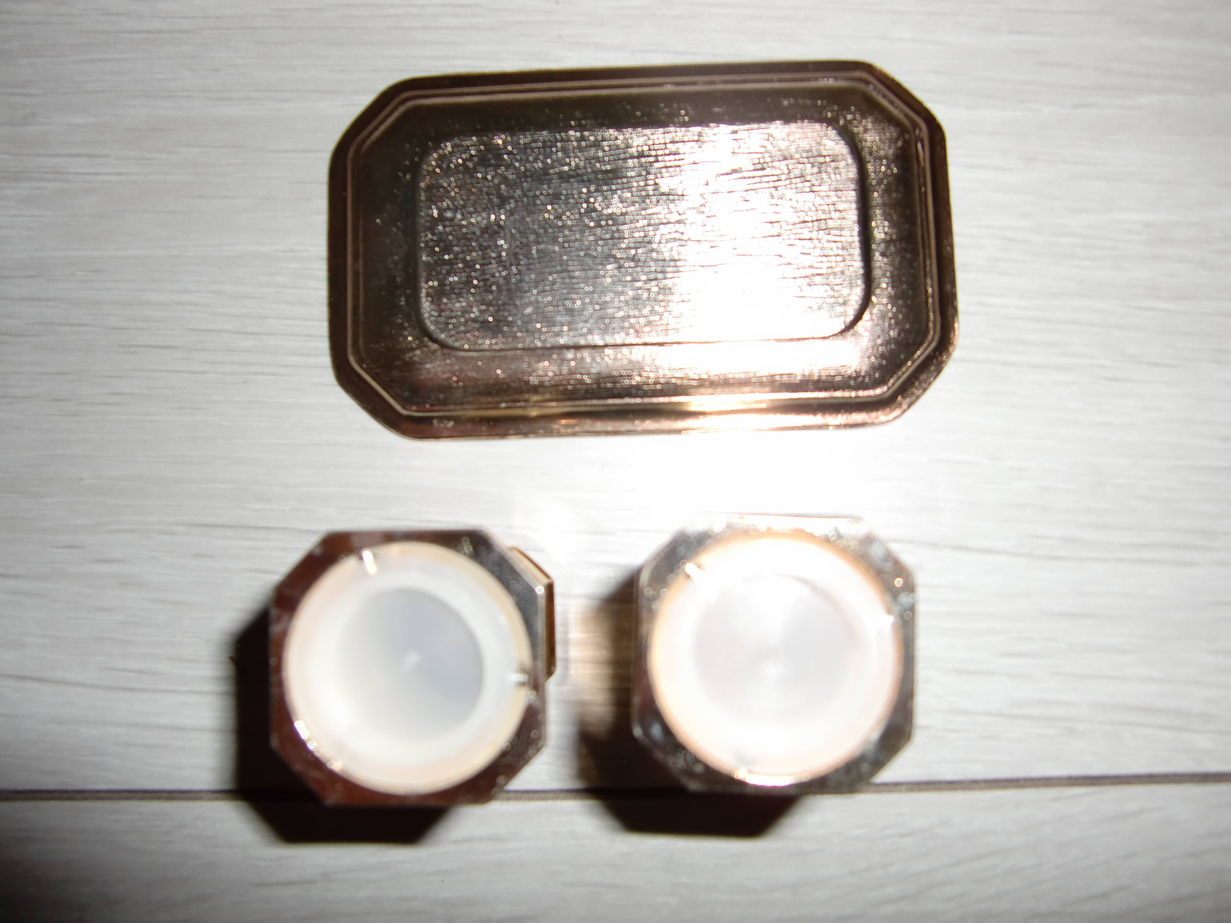 Silver-plated salt and pepper shakers presented on a small tray