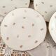 Lot de 12 assiettes à dessert en porcelaine de Limoges décor floral doré