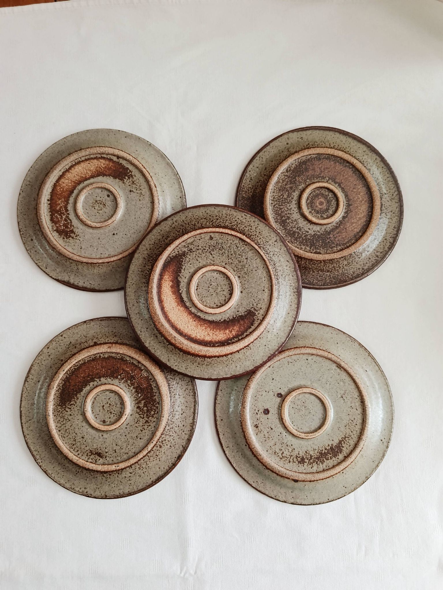 Set of 5 dessert plates by Jean Tessier, Le Cep, in pyrite stoneware.