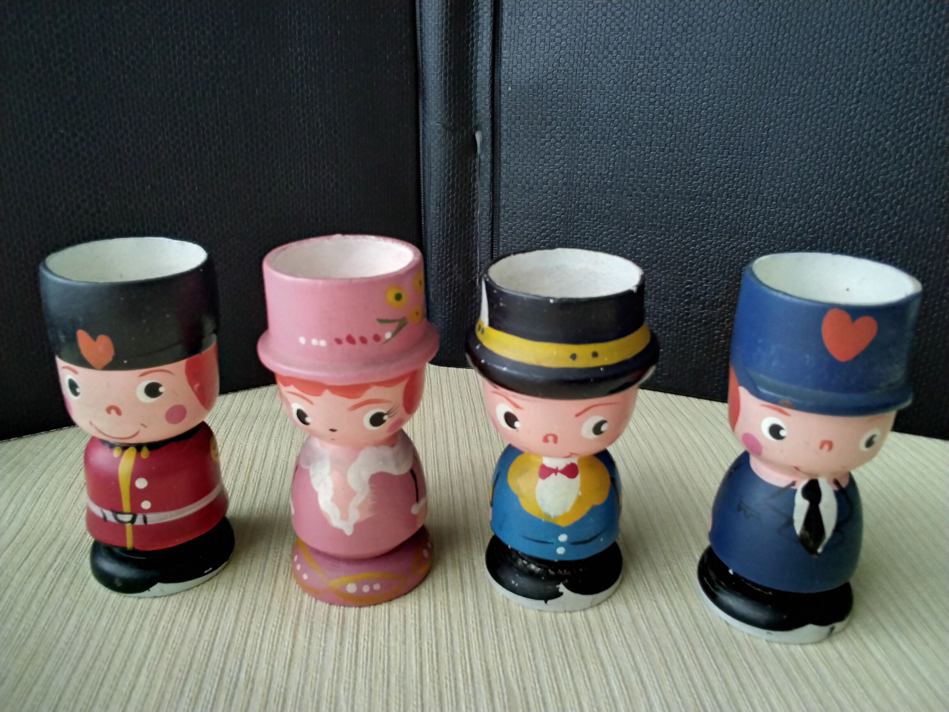 Set of 4 painted wooden characters eggcups