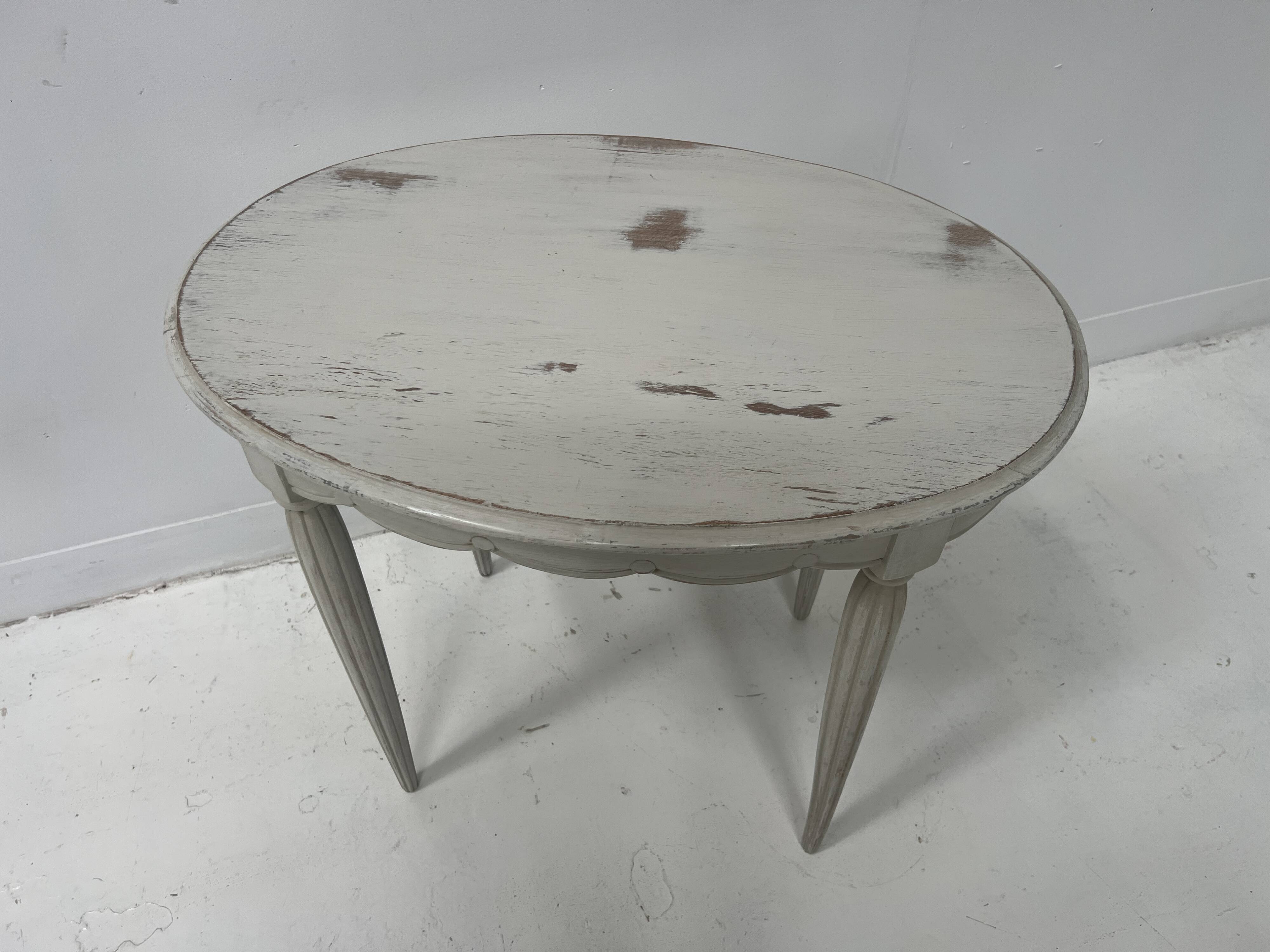 Art Deco style guéridon in patinated beech, 20th century.